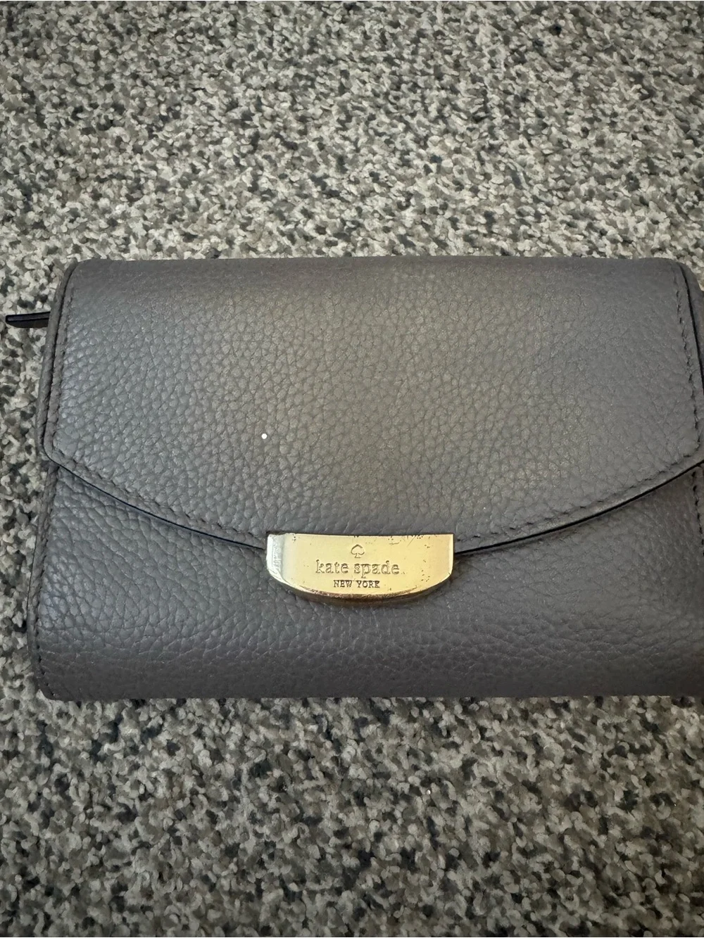 kate spade gray pebbled leather flap wallet with gold plaque